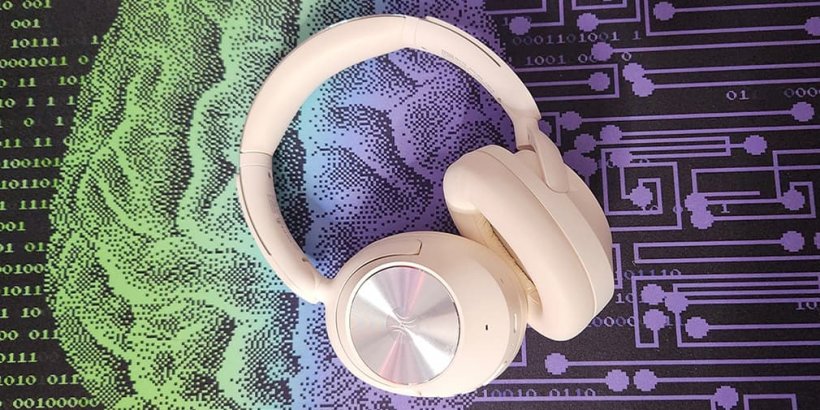 White OneOdio Focus A6 Headphones on black, green and purple background