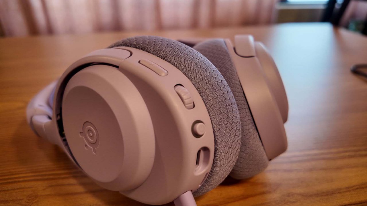 arctis nova earcups with power button, mute button, and volume slider